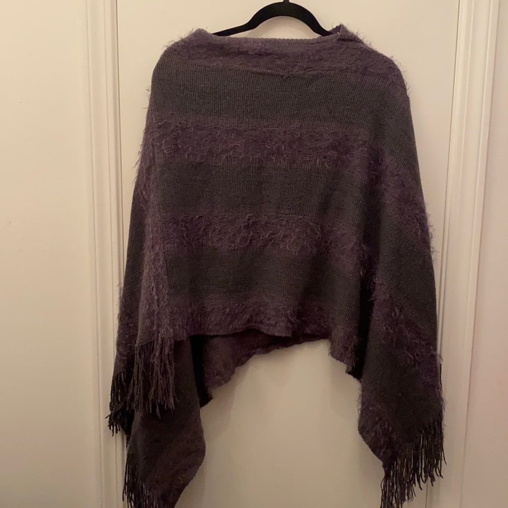 The poncho is gray.